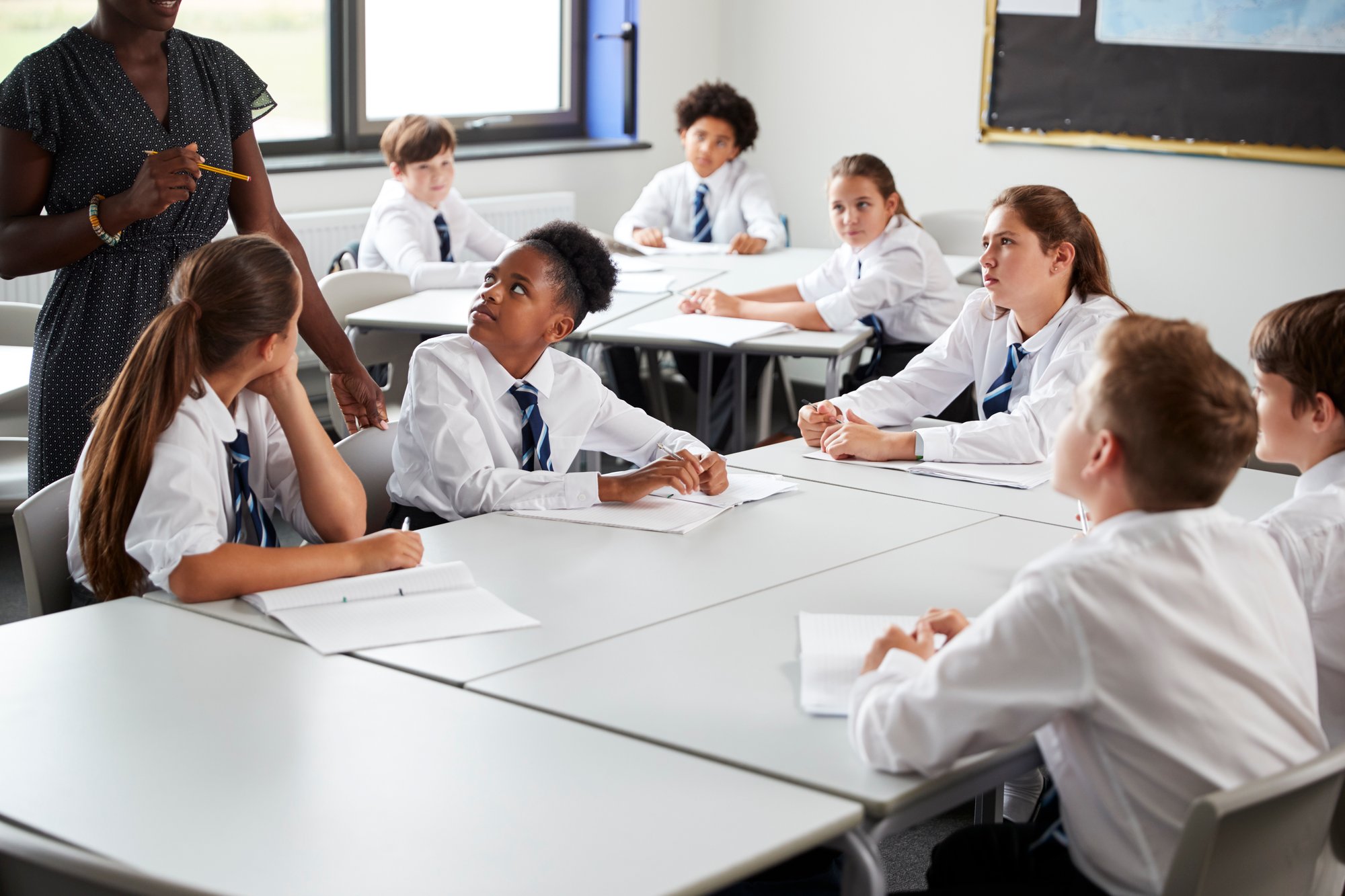 detail-of-female-high-school-tutor-helping-student-2024-10-19-15-37-23-utc